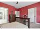 Bedroom showing a bed, a dresser, and a playhouse. There are two doors in the room at 221 Old Hickory Dr, Raleigh, NC 27603