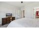 Comfortable bedroom with a TV, cozy bedding, and access to an ensuite bathroom at 221 Old Hickory Dr, Raleigh, NC 27603