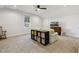 Bonus room with a ceiling fan, a striped sofa, and natural light from the window at 221 Old Hickory Dr, Raleigh, NC 27603