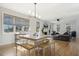 Open concept dining and living area with hardwood floors and plenty of natural light at 221 Old Hickory Dr, Raleigh, NC 27603