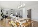 Open concept dining area with hardwood floors, natural light, and views of living room at 221 Old Hickory Dr, Raleigh, NC 27603