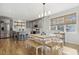 Open dining area and kitchen with island and stainless steel appliances at 221 Old Hickory Dr, Raleigh, NC 27603