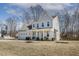 Well-maintained two-story home with a side-entry garage and a partially covered front porch at 221 Old Hickory Dr, Raleigh, NC 27603