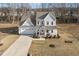 Beautiful two-story home with a welcoming front porch, attached garage, and long driveway for ample parking at 221 Old Hickory Dr, Raleigh, NC 27603