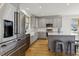 Bright kitchen with stainless steel appliances, a farmhouse sink and gray cabinets at 221 Old Hickory Dr, Raleigh, NC 27603