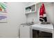 Well-equipped laundry room with modern appliances, storage shelves, and efficient design at 221 Old Hickory Dr, Raleigh, NC 27603