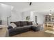 Spacious living room with a comfortable leather sectional couch and stylish decor at 221 Old Hickory Dr, Raleigh, NC 27603