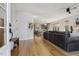 Spacious living room with hardwood floors and an open floor plan leading to the kitchen at 221 Old Hickory Dr, Raleigh, NC 27603