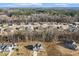 Aerial view of a residential neighborhood featuring well-maintained homes nestled among mature trees and landscapes at 221 Old Hickory Dr, Raleigh, NC 27603
