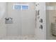 Modern bathroom featuring a spacious glass enclosed shower with white tiled walls at 221 Old Hickory Dr, Raleigh, NC 27603