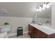 Clean bathroom with marble vanity and tile floors at 255 Dupree Rd, Willow Springs, NC 27592