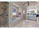 Elegant bathroom with soaking tub, walk-in shower, and double vanity at 255 Dupree Rd, Willow Springs, NC 27592