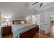 Comfortable bedroom with hardwood floors and ensuite bath at 255 Dupree Rd, Willow Springs, NC 27592