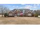 Brick home with large front yard and American flag at 255 Dupree Rd, Willow Springs, NC 27592