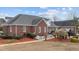 Brick home with landscaping, walkway, and partially visible pool at 255 Dupree Rd, Willow Springs, NC 27592