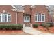 Brick front entrance with double doors and landscaping at 255 Dupree Rd, Willow Springs, NC 27592