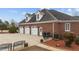 Three-car brick garage with large driveway at 255 Dupree Rd, Willow Springs, NC 27592