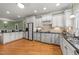 Kitchen with white cabinets, granite counters and island at 255 Dupree Rd, Willow Springs, NC 27592