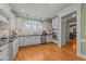 Large kitchen with white cabinets, granite counters and island at 255 Dupree Rd, Willow Springs, NC 27592