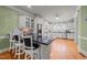 Kitchen with island, white cabinets and granite counters at 255 Dupree Rd, Willow Springs, NC 27592