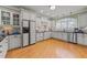 Spacious kitchen with white cabinets and granite counters at 255 Dupree Rd, Willow Springs, NC 27592