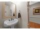 Powder room with pedestal sink and decorative mirror at 255 Dupree Rd, Willow Springs, NC 27592