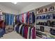 Large walk-in closet with ample hanging space and shelving at 255 Dupree Rd, Willow Springs, NC 27592