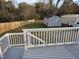 Deck overlooks backyard with storage shed and fence at 2924 E Geer St, Durham, NC 27704