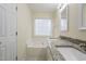 Bathroom with granite countertop and bathtub at 3124 Gross Ave, Wake Forest, NC 27587