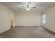 Spacious carpeted bedroom with ceiling fan and closet at 3124 Gross Ave, Wake Forest, NC 27587