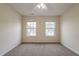 Spacious bedroom with two windows and wall-to-wall carpet at 3124 Gross Ave, Wake Forest, NC 27587