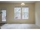 Bright dining area with two large windows and tile flooring at 3124 Gross Ave, Wake Forest, NC 27587