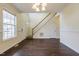 Dining room with hardwood floors, chandelier, and staircase at 3124 Gross Ave, Wake Forest, NC 27587