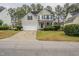 Two-story house with a gray exterior, attached garage, and well-maintained lawn at 3124 Gross Ave, Wake Forest, NC 27587