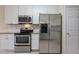Kitchen features stainless steel appliances and granite countertops at 3124 Gross Ave, Wake Forest, NC 27587