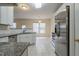 Spacious kitchen with granite countertops, stainless steel appliances, and white cabinets at 3124 Gross Ave, Wake Forest, NC 27587