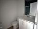 Modern bathroom with a white vanity, toilet, and shower featuring beautiful blue tile at 3275 Roundly Rd # 10, New Hill, NC 27562