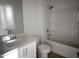 Bathroom with single vanity, mirror, and shower-tub combo at 3275 Roundly Rd # 10, New Hill, NC 27562