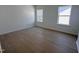Bright bedroom with wood floors and two windows for lots of natural light at 3275 Roundly Rd # 10, New Hill, NC 27562