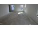 Bright bedroom with two windows and awaiting final flooring and paint at 3275 Roundly Rd # 10, New Hill, NC 27562