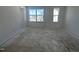 Bedroom with two windows bringing in natural light at 3275 Roundly Rd # 10, New Hill, NC 27562