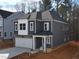 Charming two-story home features a stone facade, attached two-car garage, and neatly landscaped front yard at 3275 Roundly Rd # 10, New Hill, NC 27562
