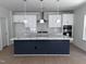 Well-equipped kitchen features a spacious island, white cabinets, and a herringbone backsplash at 3275 Roundly Rd # 10, New Hill, NC 27562