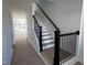 Bright entryway boasts a staircase with dark banisters and white risers leading to the upper level at 3275 Roundly Rd # 10, New Hill, NC 27562
