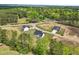 An aerial shot of a residential area with newly constructed homes set amidst green spaces and mature trees at 38 Hewitt Woods Dr, Clayton, NC 27527
