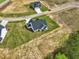 New residential development aerial view featuring modern homes with gray roofs and green lawns in a suburban setting at 38 Hewitt Woods Dr, Clayton, NC 27527