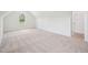 Light filled bedroom with neutral carpet and closet at 38 Hewitt Woods Dr, Clayton, NC 27527