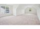Large bonus room offers flexible space with carpet and two windows at 38 Hewitt Woods Dr, Clayton, NC 27527