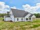 Beautiful single-Gathering home boasting white siding, large windows, and a well-maintained lawn at 38 Hewitt Woods Dr, Clayton, NC 27527