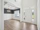 Bright foyer features an elegant chandelier and a view into the adjacent dining room at 38 Hewitt Woods Dr, Clayton, NC 27527